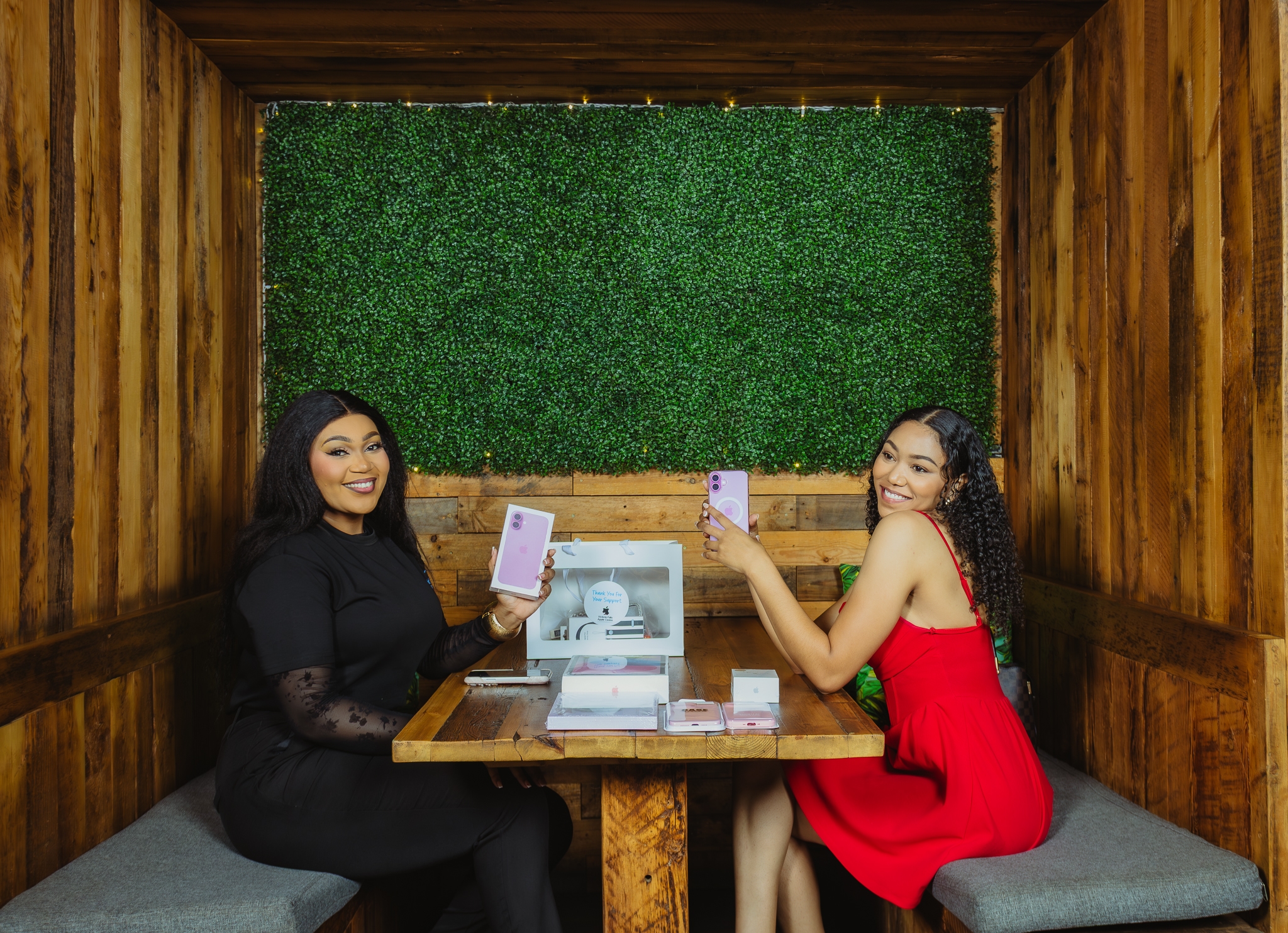 Two people unboxing new iPhones at Victoria Falls Apple Centre