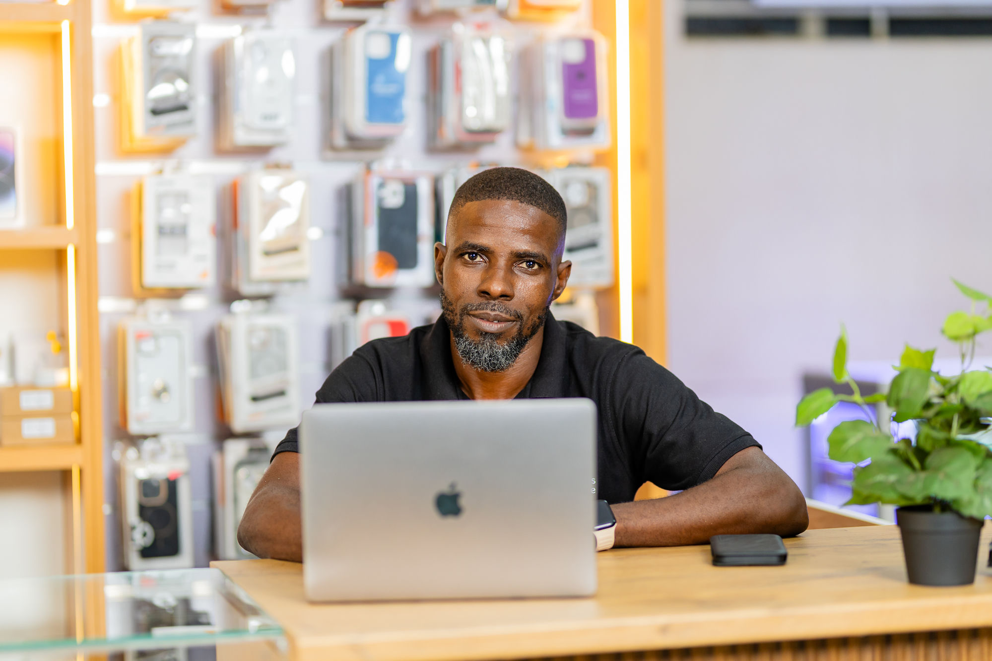 Staff member at the MacBook